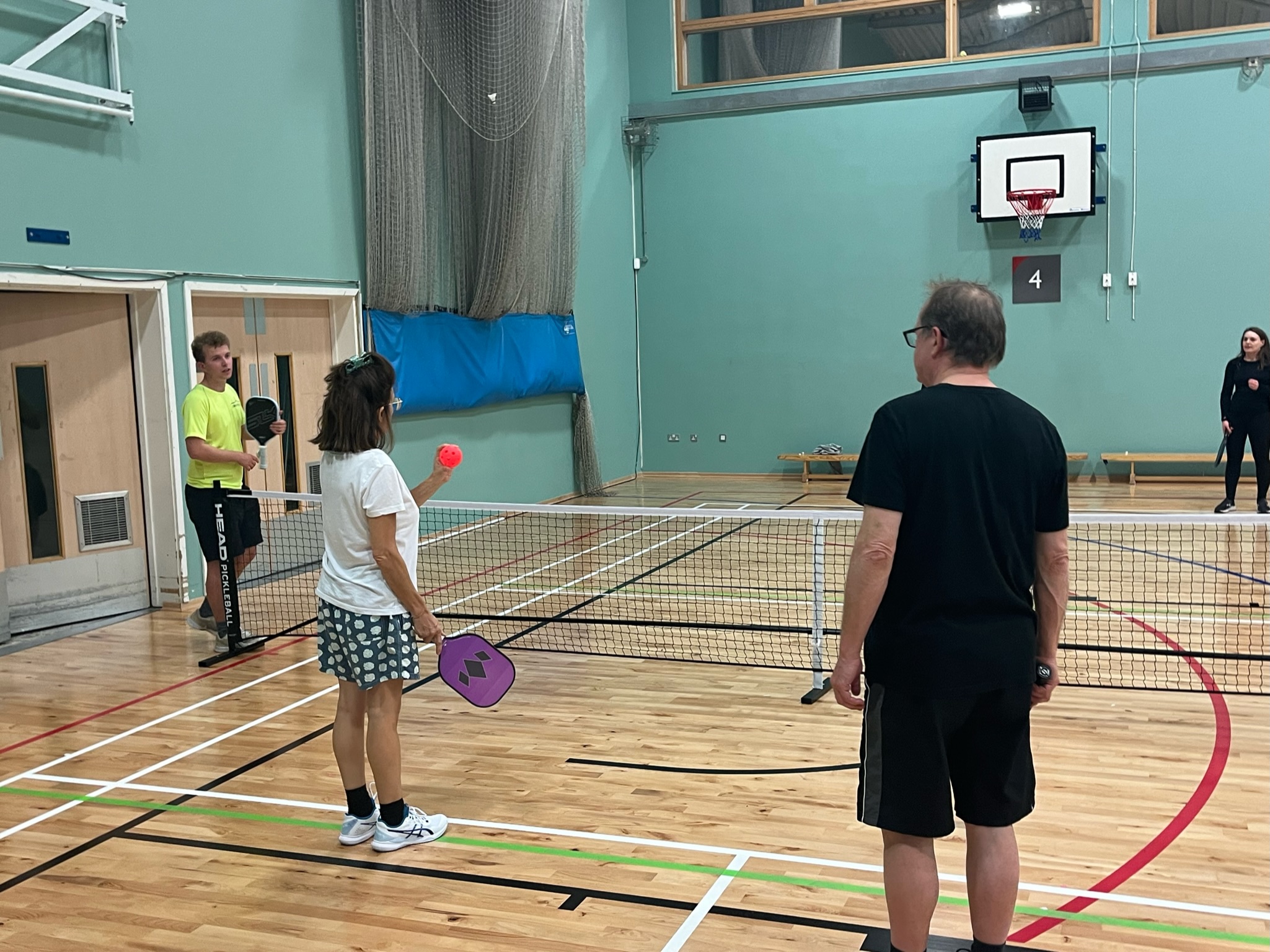 A beginner trying pickleball at a taster session