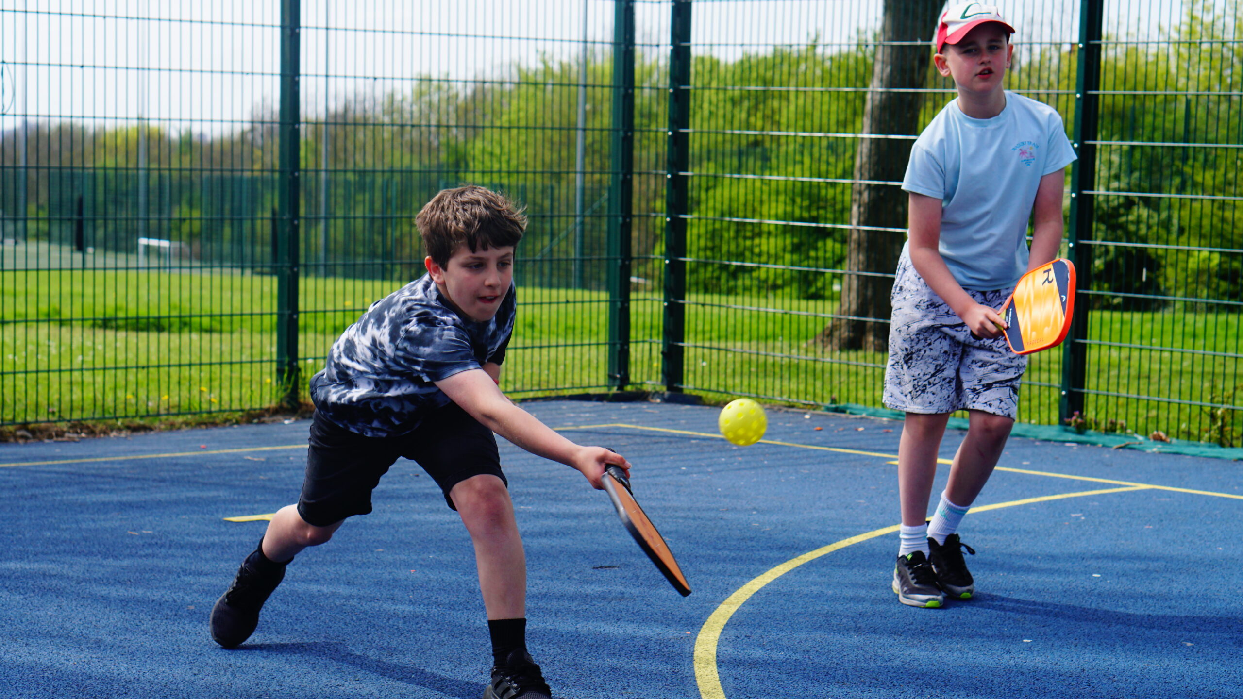 Children playing pickleball at a junior club