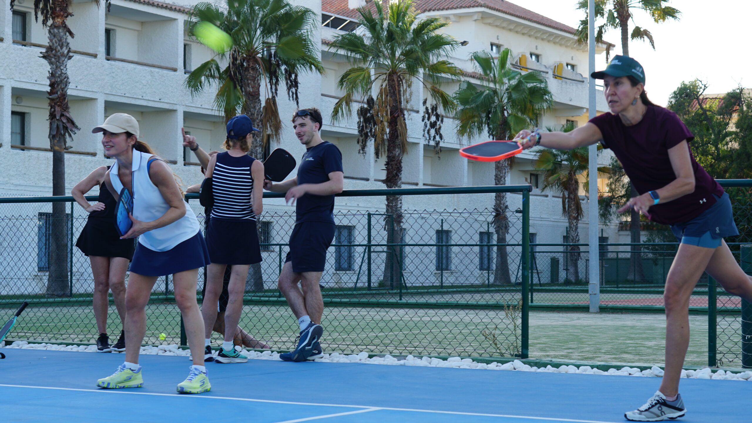 Players in a friendly social pickleball game